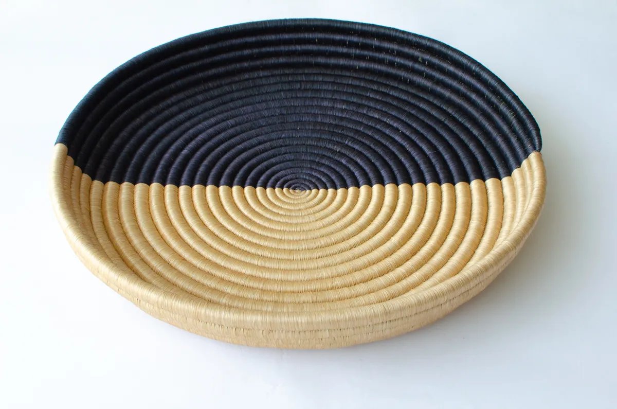 two women artisan weavers making baskets