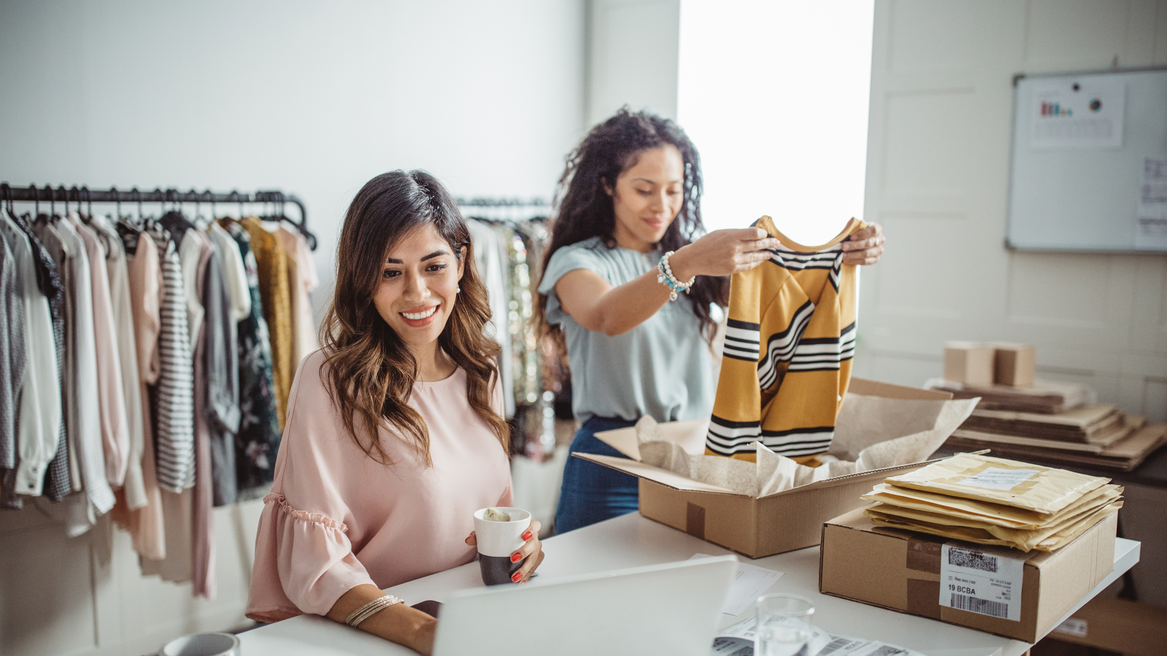 women business owners preparing shipments