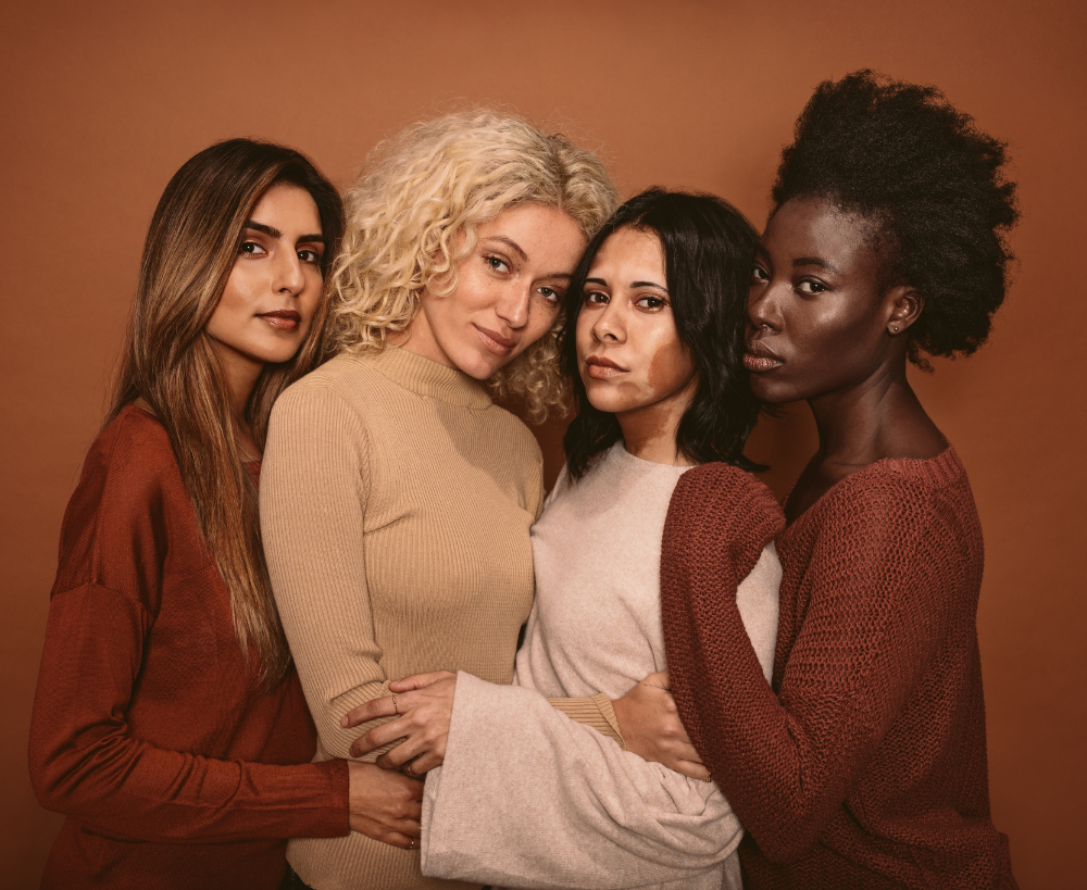 4 women of different color and race standing together to represent inclusiveness and women and BIPOC owned businesses.